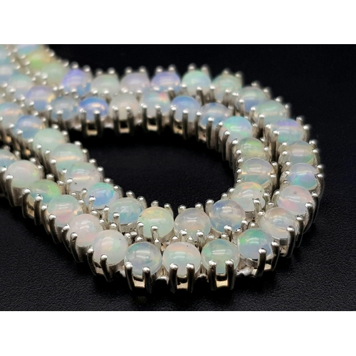 893 - An Opal Tennis Necklace on 925 Silver. 46.5cm length, 30.96g total weight.    Ref: CD-1194