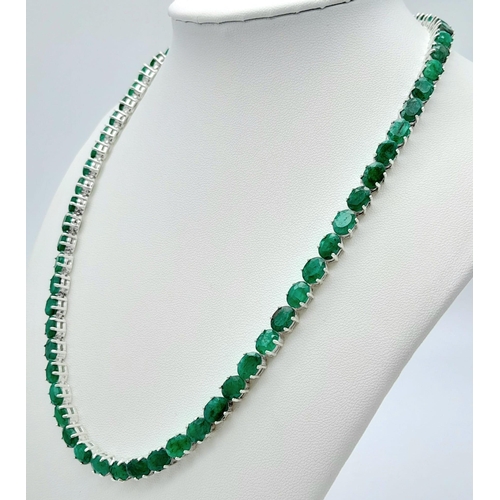 907 - An Emerald Tennis Necklace on 925 Silver. 47cm length, 0.7cm emeralds, 39.62g total weight.    Ref: ... 