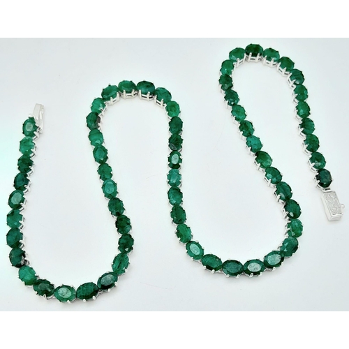 907 - An Emerald Tennis Necklace on 925 Silver. 47cm length, 0.7cm emeralds, 39.62g total weight.    Ref: ... 