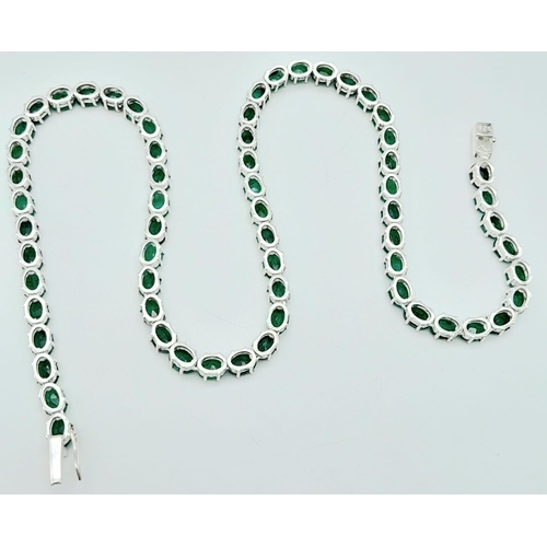 907 - An Emerald Tennis Necklace on 925 Silver. 47cm length, 0.7cm emeralds, 39.62g total weight.    Ref: ... 