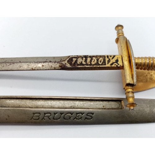 951 - A miniature bayonet with Bruges on the blade and a miniature Toledo sword letter openers. Bayonet 12... 