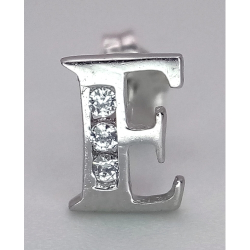 1077 - A 9K WHITE GOLD INITIAL E STONE SET STUD SINGLE EARRING 0.25G

SC 4043