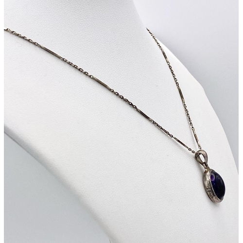 1089 - A vintage 925 silver Purple stone pendant on silver chain. Total weight 8.15G. Total length 58cm.