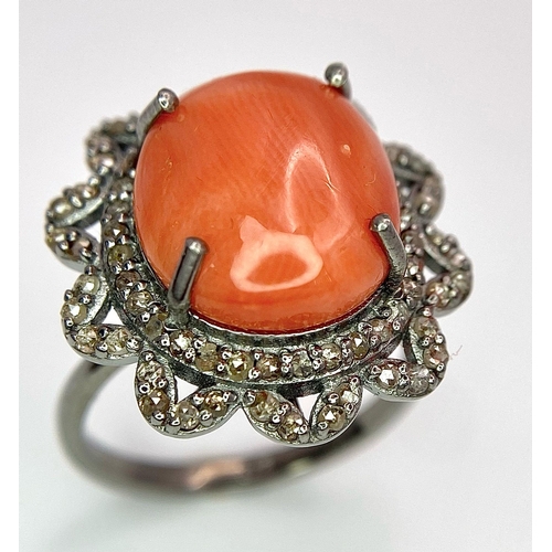 1095 - A Coral Ring with Diamond Surround on 925 Silver. 5.55ct coral, 0.75ctw diamonds. Size N/O, 5g total... 