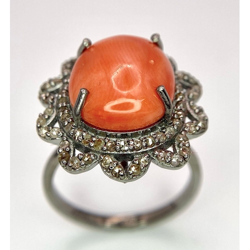 1095 - A Coral Ring with Diamond Surround on 925 Silver. 5.55ct coral, 0.75ctw diamonds. Size N/O, 5g total... 