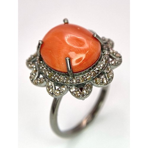 1095 - A Coral Ring with Diamond Surround on 925 Silver. 5.55ct coral, 0.75ctw diamonds. Size N/O, 5g total... 