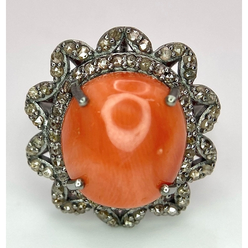 1095 - A Coral Ring with Diamond Surround on 925 Silver. 5.55ct coral, 0.75ctw diamonds. Size N/O, 5g total... 