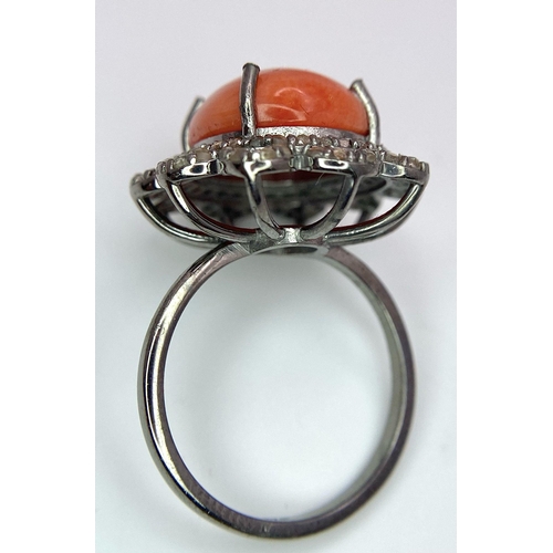 1095 - A Coral Ring with Diamond Surround on 925 Silver. 5.55ct coral, 0.75ctw diamonds. Size N/O, 5g total... 