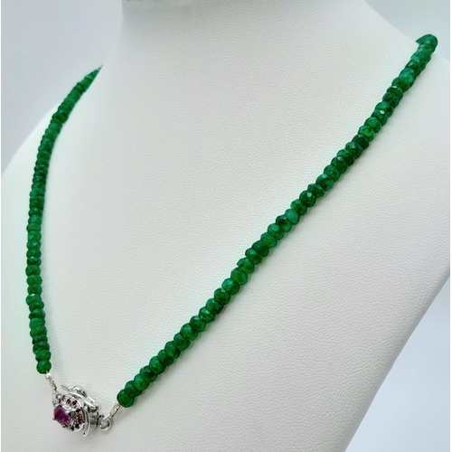 1186 - A 70ctw Emerald Necklace with a Ruby and 925 Silver Clasp. 46.5cm length, 17g total weight.    Ref: ... 