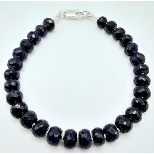 1197 - A 95ctw Rondelle Blue Sapphire Bracelet with 925 Silver Clasp. 19.5cm length, 18.36g total weight.  ... 