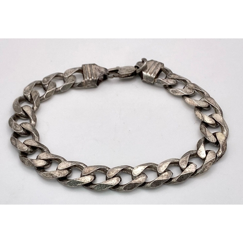 1198 - A vintage 925 silver curb link bracelet. Total weight 31.5G. Total length 24cm.