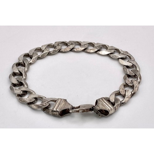 1198 - A vintage 925 silver curb link bracelet. Total weight 31.5G. Total length 24cm.