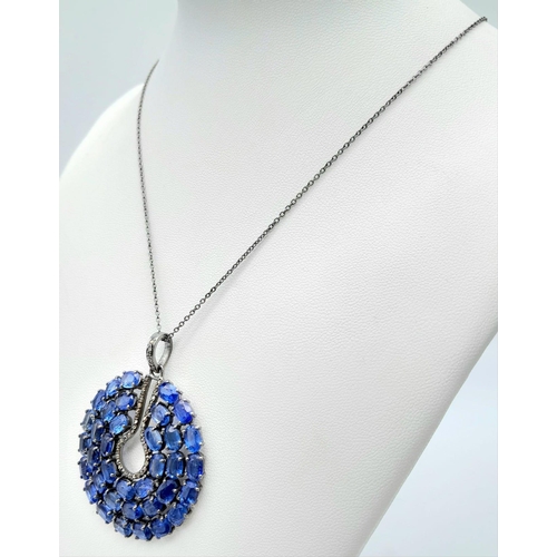 1211 - A Kyanite Pendant with Diamond Accents on a 925 Silver Chain. 24ctw kyanites, 0.55ctw diamonds. 5cm ... 