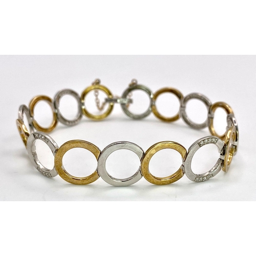 564 - A 9K TWO TONE GOLD DIAMOND SET CIRCLES LINK BRACELET WITH SAFETY CHAIN 12.8G , approx 20cm length

r... 