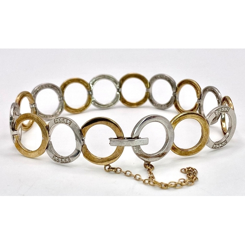 564 - A 9K TWO TONE GOLD DIAMOND SET CIRCLES LINK BRACELET WITH SAFETY CHAIN 12.8G , approx 20cm length

r... 