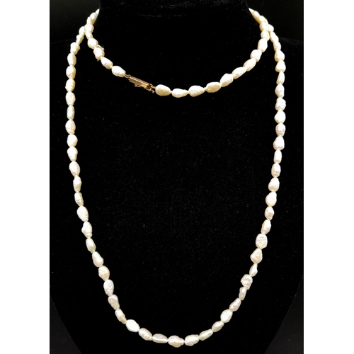 674 - A Vintage Rice Pearl Necklace with a 9K Gold Clasp. 74cm.