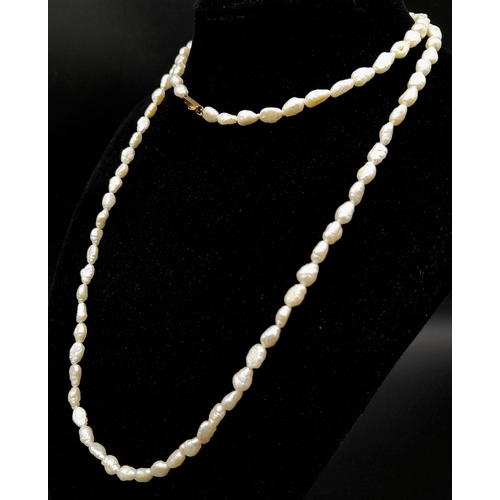 674 - A Vintage Rice Pearl Necklace with a 9K Gold Clasp. 74cm.