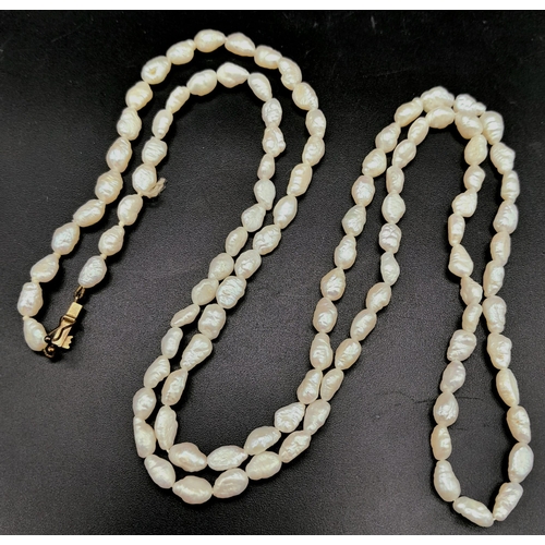 674 - A Vintage Rice Pearl Necklace with a 9K Gold Clasp. 74cm.