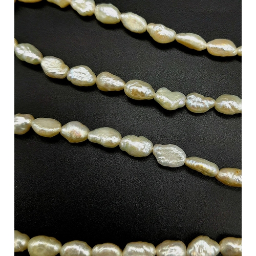 674 - A Vintage Rice Pearl Necklace with a 9K Gold Clasp. 74cm.