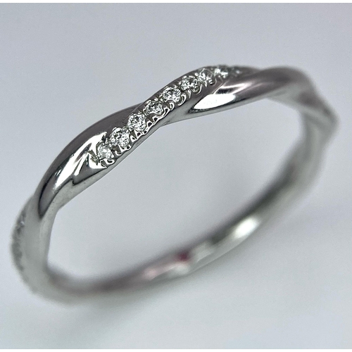 747 - A STYLISH 18K WHITE GOLD DIAMOND SET TWISTED BAND RING, WEIGHT 1.8G, SIZE J 1/2