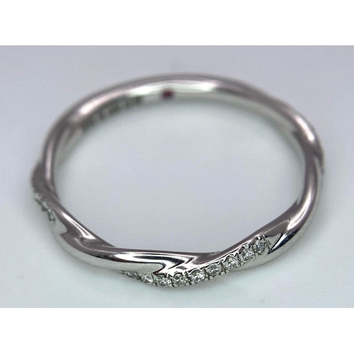 747 - A STYLISH 18K WHITE GOLD DIAMOND SET TWISTED BAND RING, WEIGHT 1.8G, SIZE J 1/2