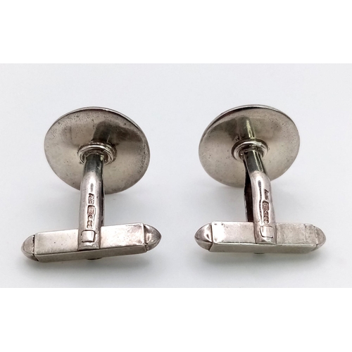 773 - A STERLING SILVER CUFFLINKS 11.8G. 15mm diameter

ref: 7963