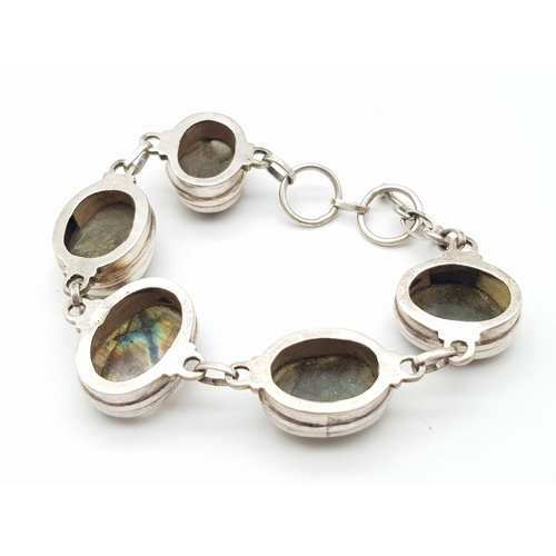 775 - A GORGEOUS STERLING SILVER  STONE SET BRACELET, BELIEVED TO BE CARVED LABRODITE STONES, T BAR CLASP,... 