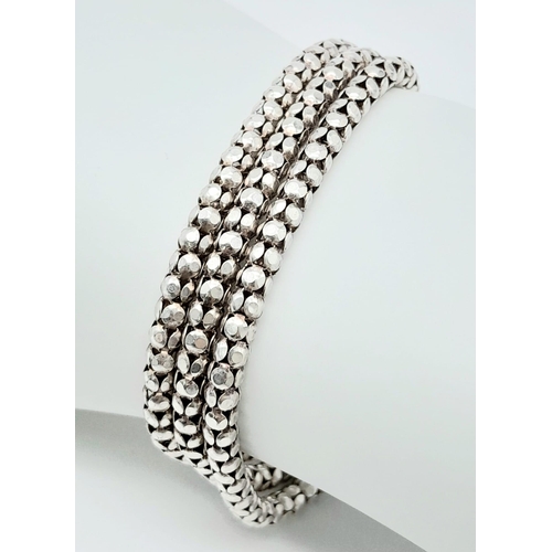 872 - A stylist Italian 925 silver triple row popcorn link bracelet. Total weight 17.4G. Total length 17cm... 