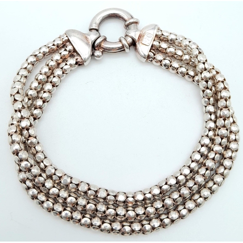 872 - A stylist Italian 925 silver triple row popcorn link bracelet. Total weight 17.4G. Total length 17cm... 