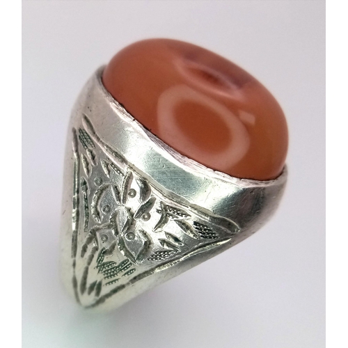 894 - A Vintage or Older Silver Carnelian Cabochon Ring Size U. Detailed Shoulders. Crown is set with a 2c... 