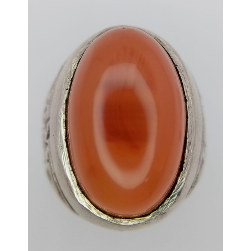 894 - A Vintage or Older Silver Carnelian Cabochon Ring Size U. Detailed Shoulders. Crown is set with a 2c... 