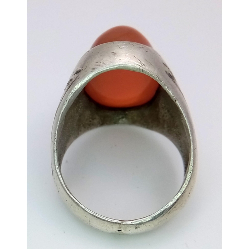 894 - A Vintage or Older Silver Carnelian Cabochon Ring Size U. Detailed Shoulders. Crown is set with a 2c... 