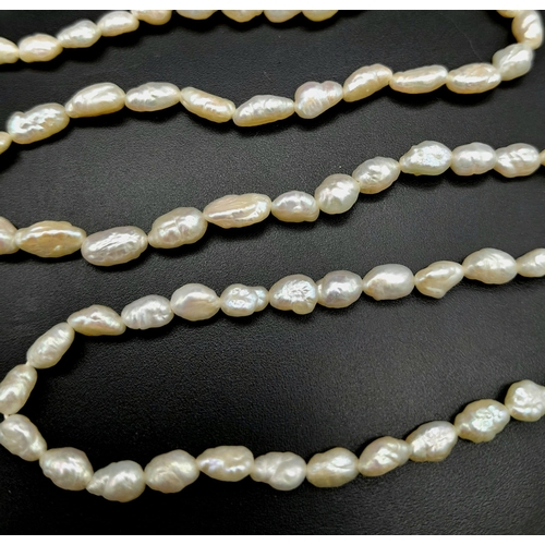 932 - A Vintage Rice Pearl Necklace with 9K Gold Clasp. 56cm length.