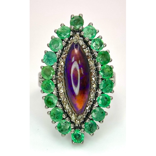 945 - A Black Opal Ring with an Emerald and Diamond Surround on 925 Silver. 2.3ctw emeralds, 0.40ctw diamo... 