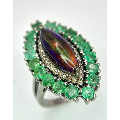 945 - A Black Opal Ring with an Emerald and Diamond Surround on 925 Silver. 2.3ctw emeralds, 0.40ctw diamo... 