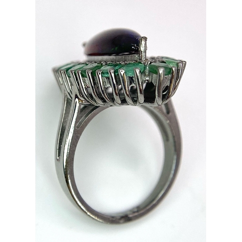 945 - A Black Opal Ring with an Emerald and Diamond Surround on 925 Silver. 2.3ctw emeralds, 0.40ctw diamo... 