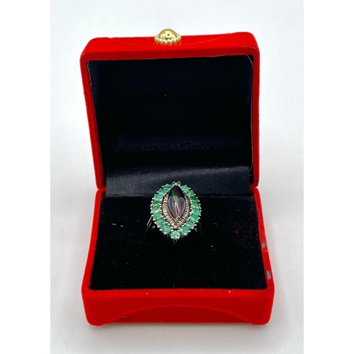 945 - A Black Opal Ring with an Emerald and Diamond Surround on 925 Silver. 2.3ctw emeralds, 0.40ctw diamo... 