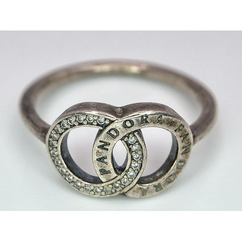 956 - A vintage 925 silver Pandora interlinked circle stone set ring. Total weight 2.35G. Size P.