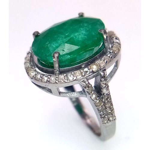 961 - An Emerald Ring with a Halo of Diamonds on 925 Silver. 7.55ct emerald, 0.67ctw diamonds. Size N, 4.9... 