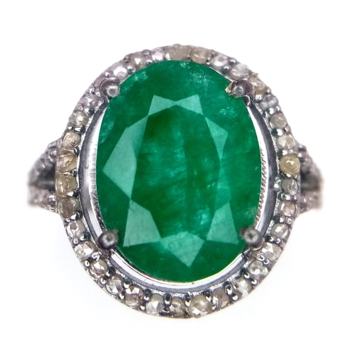 961 - An Emerald Ring with a Halo of Diamonds on 925 Silver. 7.55ct emerald, 0.67ctw diamonds. Size N, 4.9... 