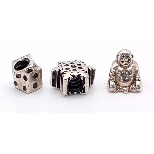 983 - A SELECTION OF 3 STERLING SILVER CHAMALIA CHARMS TO INCLUDE: SNOWFLAKE, BUDDHA & DICE 9.4G

SC 4140