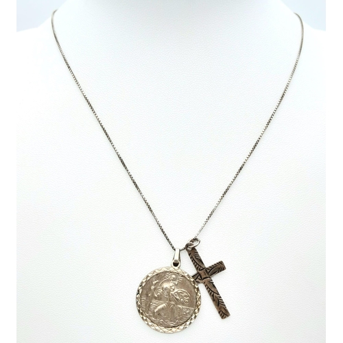 998 - A vintage sterling silver necklace with silver St Christopher and cross pendants. Total weight 7.2G.... 