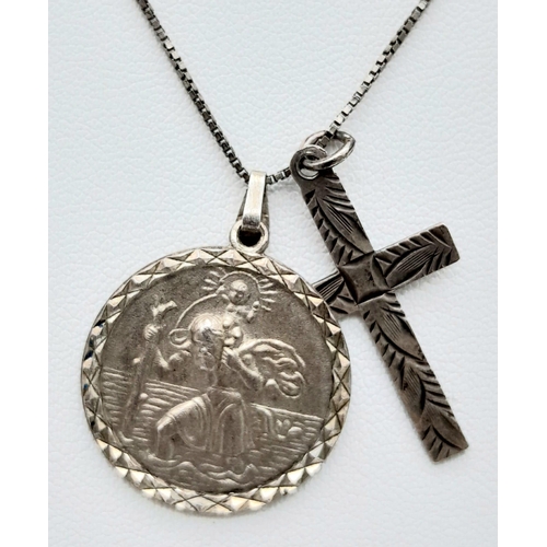 998 - A vintage sterling silver necklace with silver St Christopher and cross pendants. Total weight 7.2G.... 