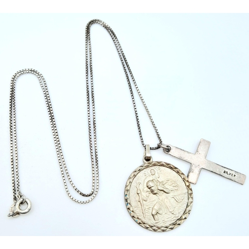 998 - A vintage sterling silver necklace with silver St Christopher and cross pendants. Total weight 7.2G.... 