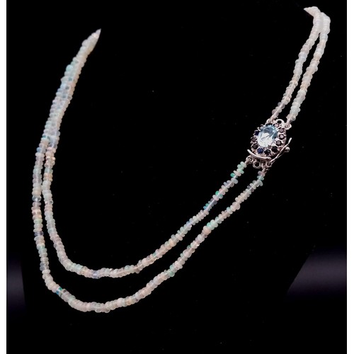 673 - An Ethiopian Opal 2 Strand Necklace with an Aquamarine 925 Silver Pendant Clasp. Small colour-play r... 