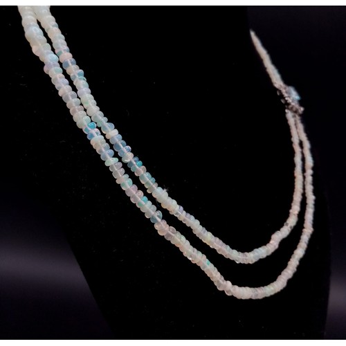 673 - An Ethiopian Opal 2 Strand Necklace with an Aquamarine 925 Silver Pendant Clasp. Small colour-play r... 