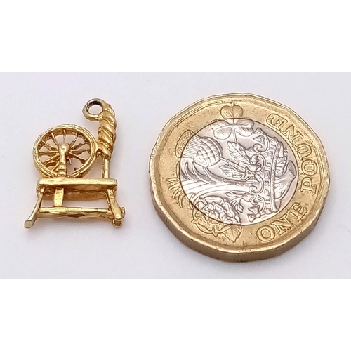 1461 - A Vintage 9K Yellow Gold Spinning Wheel Pendant/Charm. 2cm. 1.5g weight.