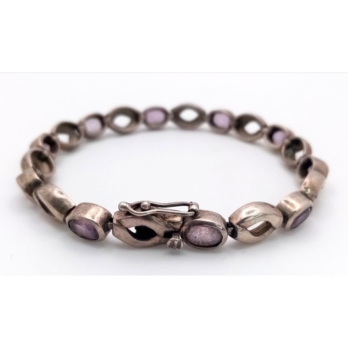 963 - A vintage 925 silver  Amethyst link bangle. Total weight 21.7G. Total length 22cm.