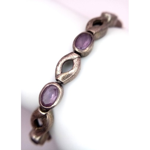 963 - A vintage 925 silver  Amethyst link bangle. Total weight 21.7G. Total length 22cm.