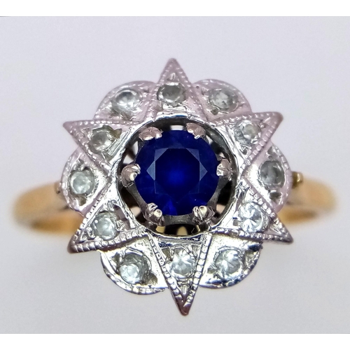 1231 - A VINTAGE 18K DIAMOND AND SAPPHIRE DRESS RING IN STAR SHAPE .    3.9gms   size R